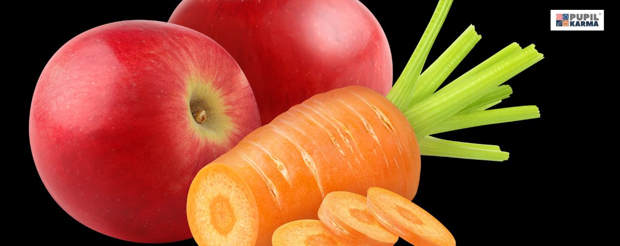 Owoce i warzywa jako smaczki. Zdjęcie jabłek i marchewek na czarnym tle. Logotyp pupilkarma.